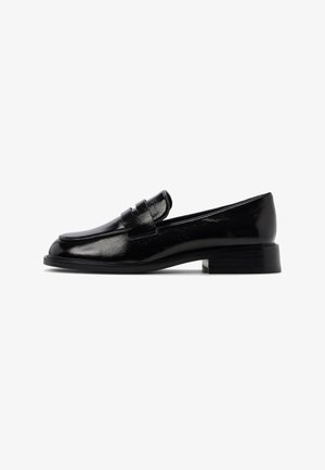 Black shiny leather loafer with low block heel and penny strap detail, shown in side profile on a white background.
