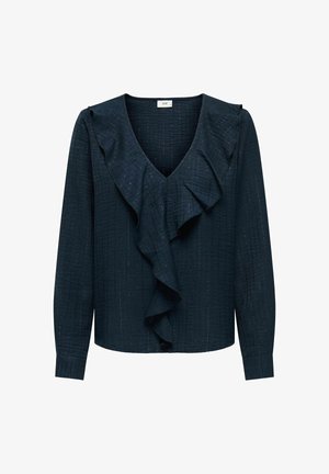 Tumši zils ilgstošas piedurknes blūze ar dziļu V-veida kakla izgriezumu un lielu volānu pa priekšu. Teksturēta auduma ar smalkiem metāliskajiem diegiem.