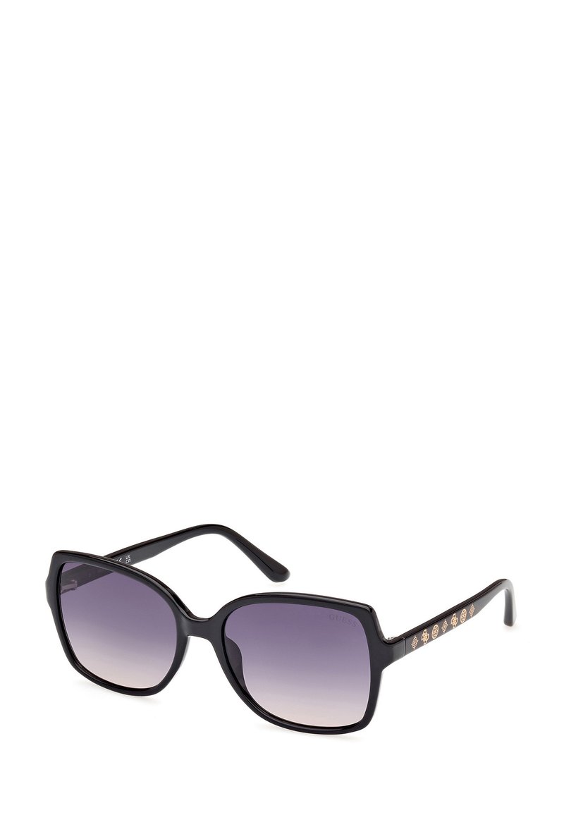 Gafas de sol negras con montura cuadrada sobredimensionada, lentes morados en degradé y detalles en tono dorado a lo largo de las patillas.