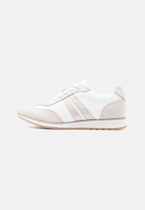 White and beige athletic shoe with suede and mesh panels, lace-up design, rubber sole, and subtle branding on the side.