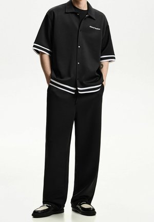 Pantalones deportivos - black