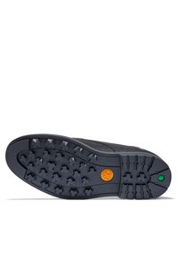 Calzature nere con suola in gomma testurizzata caratterizzata da un motivo a stella e dettagli arancioni e verdi. Design robusto adatto a diversi terreni.