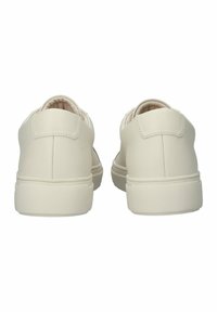 White sneakers with a smooth synthetic upper, rounded shape, and a cushioned collar. Rubber sole with a minimalistic design and no additional accents.