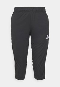 Pantalones deportivos negros con cintura elástica, piernas ajustadas y logo blanco de Adidas en el lado izquierdo. Fabricados con una tela suave y ligera.