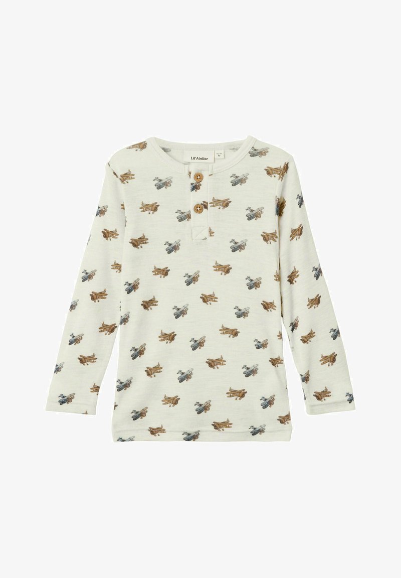 Košulja s dugim rukavima u krem boji s ponovljenim uzorkom vintage aviona u smeđoj i plavoj boji, s plaketom na tri gumba.