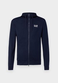 Mörkblå zip-up hoodie i mjukt tyg med dragsko i huvan och EA7-logotyp på vänster bröst. Ribbstickade muddar och fåll.