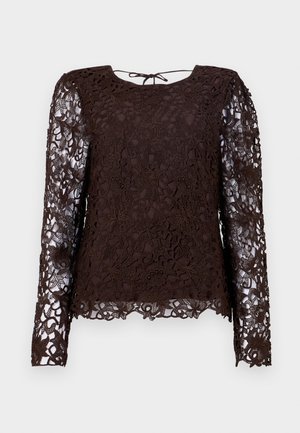 Blouse longue à manches en dentelle marron avec un motif floral, manches transparentes, encolure ronde et fermeture à nouer dans le dos.