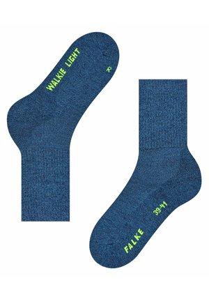 Calzini blu con una lavorazione testurizzata, caratterizzati da dettagli di colore verde lime e brandizzazione. Taglie 39-41 indicate sulle suole.