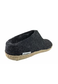 Black felt slipper with a low, rounded design. Natural tan sole with a textured finish. Small label on the side identifies the brand.