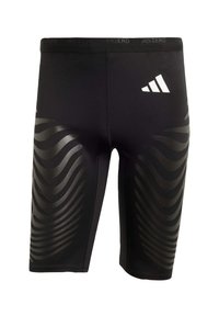 Zwarte sportshorts met een stretchy fit, voorzien van een glanzend golfpatroon aan de zijkanten en een wit logo op de tailleband.