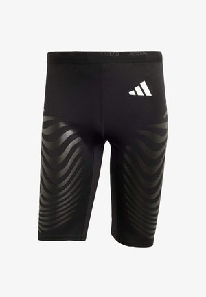 Shorts sportivi neri con una vestibilità elasticizzata, caratterizzati da un motivo a onde lucido sui lati e un logo bianco sulla vita.