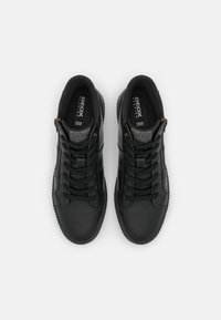 Black leather high-top shoes with textured accents and laces. Side zipper and Geox branding visible on the insole. Durable rubber outsole.
