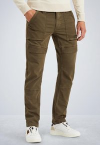 Khaki cargo pants made of cotton, featuring multiple pockets, a straight fit, and subtle texture. Paired with white sneakers.