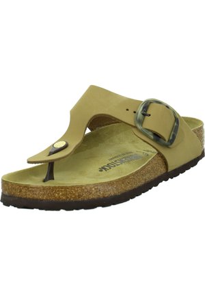 Lichtbruine slipper met een brede band, verstelbare gesp en kurken voetbed. Geweven zool voor grip en comfort.