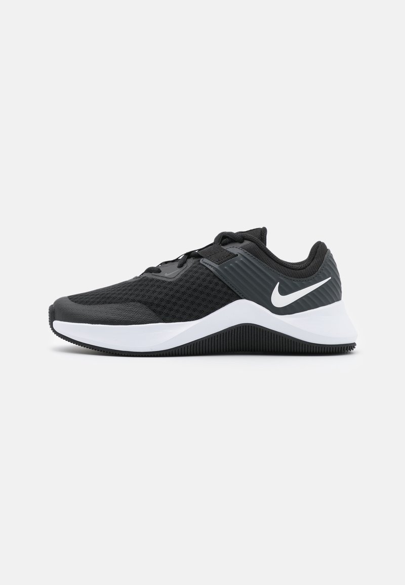 Black athletic shoes feature a mesh upper, textured gray panels, and a white midsole with a black rubber outsole. Nike swoosh logo displayed.