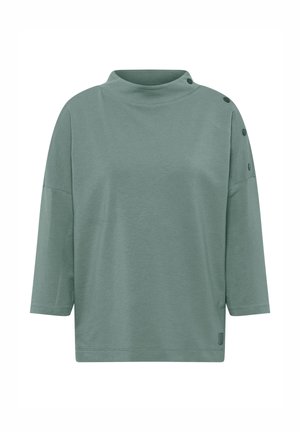 Haut en jersey léger et vert avec un col montant, des manches trois-quarts et des accents de boutons sur l'épaule gauche. Coupe simple et décontractée.