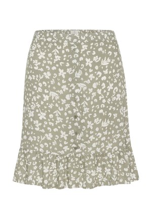 Zelena pamučna suknja s bijelim cvjetnim uzorkom, s volanima na rubu i prednjim kopčanjem na dugmad. Glatka tekstura, dizajn do koljena.