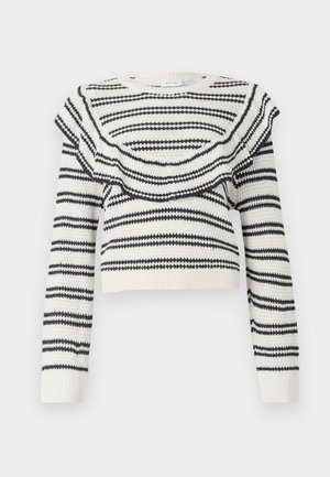 Biały sweter dzianinowy z czarnymi poziomymi paskami, z falbaniastym dekoltem i długimi rękawami. Skrócony fason z prążkowanymi mankietami.