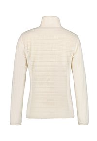 Veste en polaire couleur crème avec un panneau arrière texturé et des manches longues lisses, dotée d'un col haut et d'une silhouette ajustée.