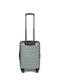 Valigia rigida di colore grigio metallizzato, con superficie textured, manico estraibile e quattro ruote per la mobilità.