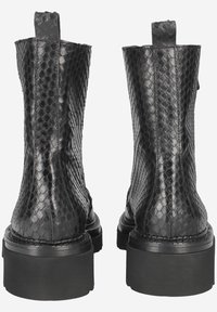 Black, textured ankle boots made of snake-patterned material. The design features a thick, black sole and pull tabs on the back.