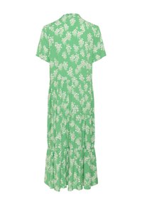 Rochie florală verde, cu mâneci scurte, fustă în straturi și guler rotund. Materialul prezintă model de mici flori albe.