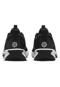Black athletic shoes featuring a textured upper, white accents, and a unique logo on the heel. The design includes perforated details for breathability.