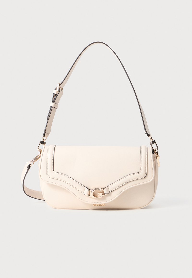 Beige handbag with curved top seam, gold hardware, and adjustable strap. Smooth leather texture, featuring subtle logo accent on front.