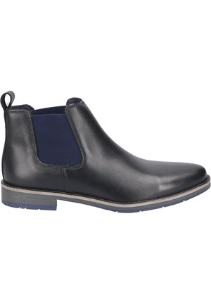 Bottines Chelsea en cuir noir avec panneaux élastiques bleu marine, bout rond et petit talon empilé ; elles présentent une languette pour plus de commodité.