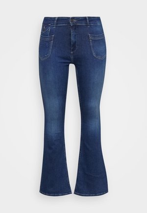 Mørkeblå højttaljede denimjeans med forreste påsyede lommer og en let vidde forneden.