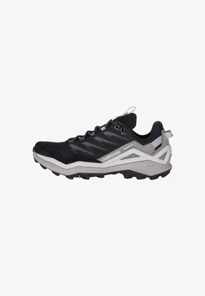 Scarpa da trail running in mesh nero e grigio, dotata di punta rinforzata, tomaia testurizzata e suola in gomma con tacchetti profondi per una migliore aderenza.