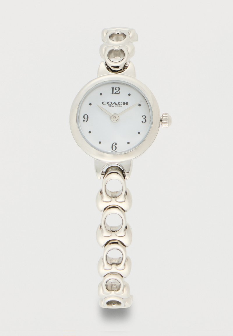 Montre-bracelet Silver Coach avec cadran blanc, chiffres noirs aux positions 12, 3, 6, 9, et bracelet chaîne à maillons circulaires décoratifs.