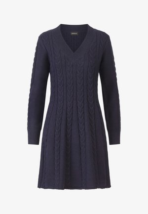 Vestido de punto de canalé en color navy con escote en V y mangas largas, que presenta patrones texturizados y un dobladillo acampanado. Fabricado con una suave tela de punto.