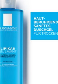 Blue plastic bottle of Lipikar gel lavant, featuring a pump top. Text on label includes product info and benefits for sensitive skin.