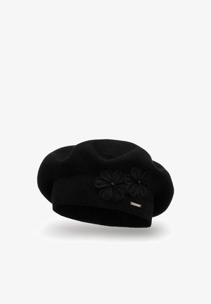 Schwarze Strick-Beret mit runder Form, verziert mit zwei floralem Applikationen und einem kleinen metallischen Akzent. Weiche Textur, zeitloses Design.