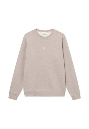Light beige sweatshirt made of soft fabric, featuring a crew neck, long sleeves, and a small embroidered design on the chest.