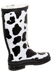 Black and white cow-patterned rubber rain boot with a smooth finish, textured black trim, and a treaded sole for grip.