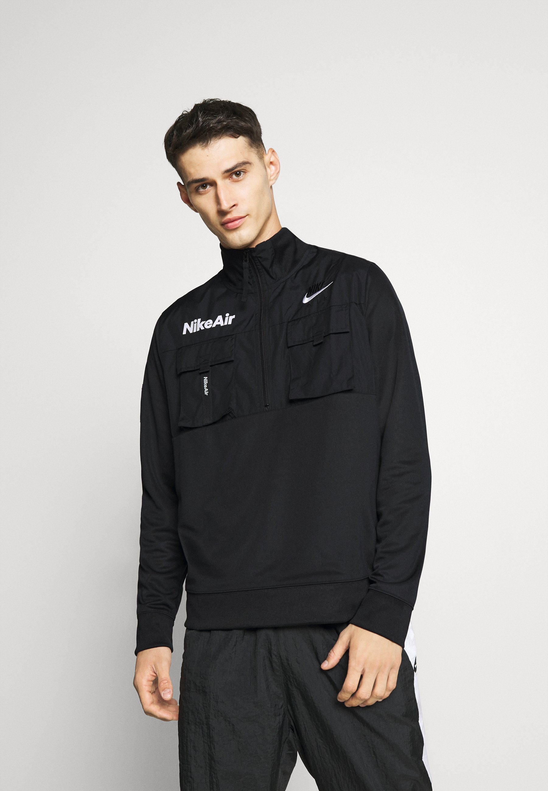 nike windbreaker pants with pockets