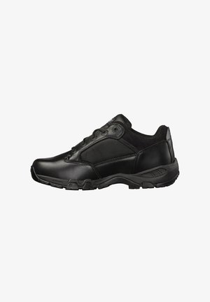 Black athletic shoes with a combination of smooth leather and mesh panels. They feature a textured rubber sole and lace-up front closure.