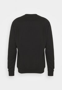 Sweatshirt noir à manches longues, col rond, poignets et ourlet côtelés. Confectionné dans un tissu lisse et texturé. Dos uni, sans motifs.