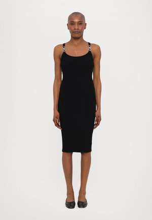 Black ribbed bodycon dress with wide straps featuring metallic accents. Knee-length design, fitted silhouette, and smooth texture.