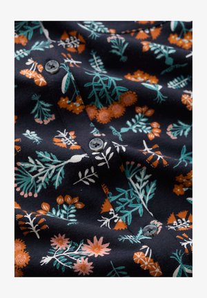 Tume riie, millel on sinakasrohelised lehed ja oranžid lillemustrid, keskel õmmeldud ümarad hallid nupud.