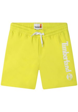 Shorts de bain jaunes fluo avec une taille élastique et un cordon blanc. Dotés du logo et de l'emblème "Timberland" sur le côté gauche.