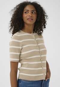 Beige rib-knit cardigan with horizontal white stripes, short sleeves, and round neckline. Secured with round buttons along the front.
