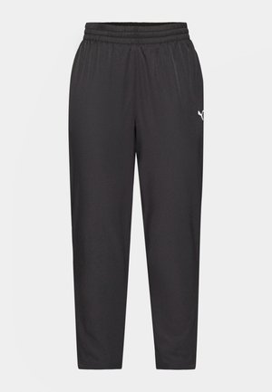 Schwarze Sporthose mit elastischem Bund, schmal zulaufenden Beinen, glatter Textur und einem kleinen weißen Logo auf der linken Hüfte.