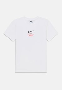 White cotton t-shirt featuring a black Nike logo and red text on the front, crew neck design, short sleeves, and standard fit.