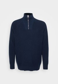 Ναυτική ζακέτα με φερμουάρ στον λαιμό, φτιαγμένη από ριγέ ύφασμα. Διαθέτει όρθιο γιακά και μανίκια ράγκλαν. Χαλαρή εφαρμογή με ίσια άκρη.