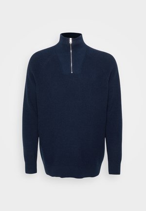 Granatowy sweter z zamkiem na szyi, wykonany z prążkowanego materiału. Posiada kołnierz stojący i raglanowe rękawy. Luźny krój z prostym hemem.