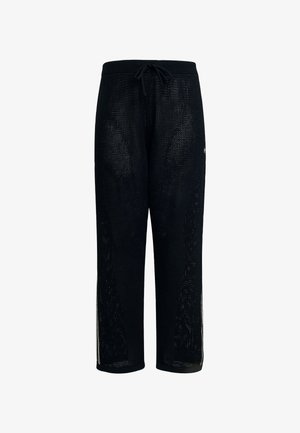 Czarne spodnie siateczkowe z elastycznym pasek, wyposażone w boczne rozcięcia i luźny krój. Wykonane z oddychającego materiału, idealne do codziennego noszenia.