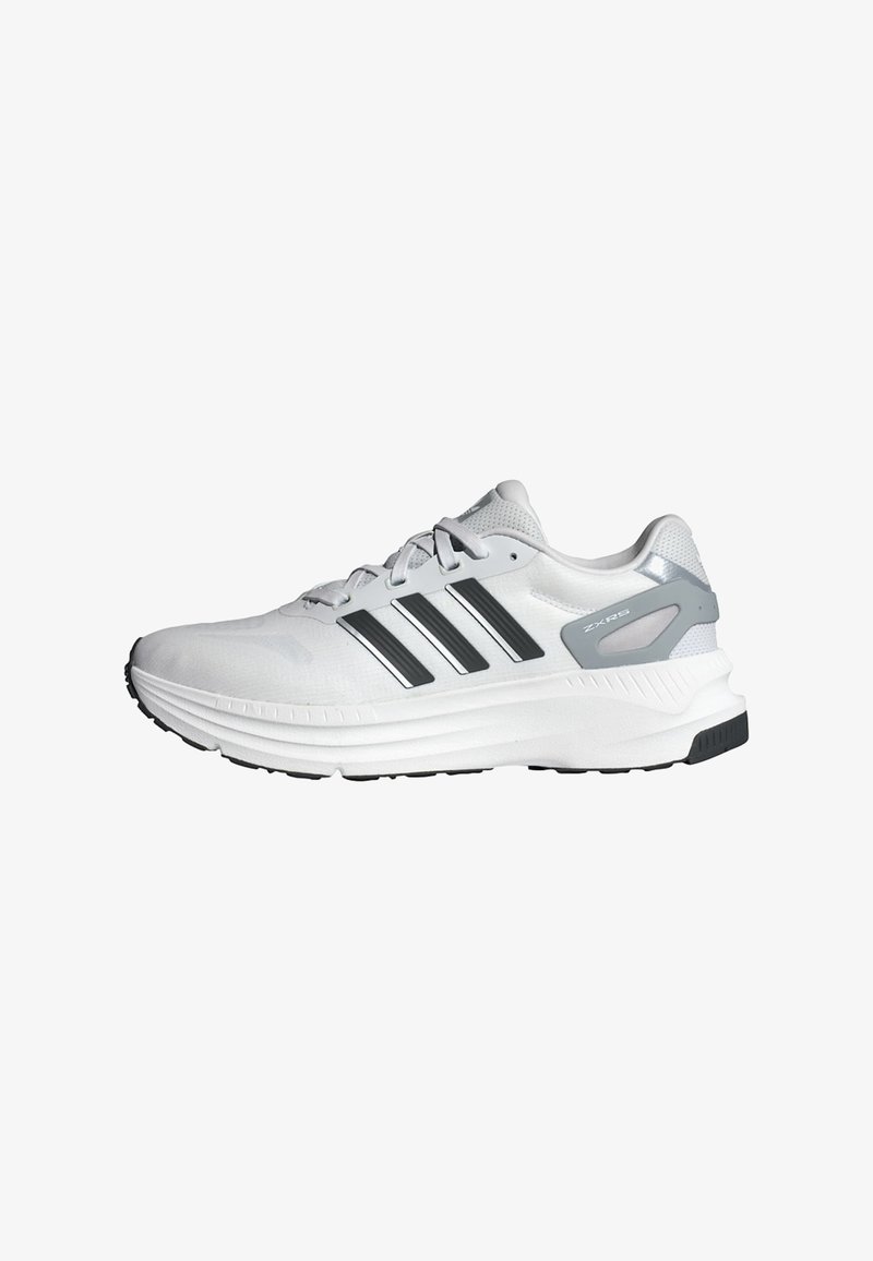 White athletic shoes with grey accents and three black stripes. Mesh upper, cushioned sole, and textured rubber outsole for grip.